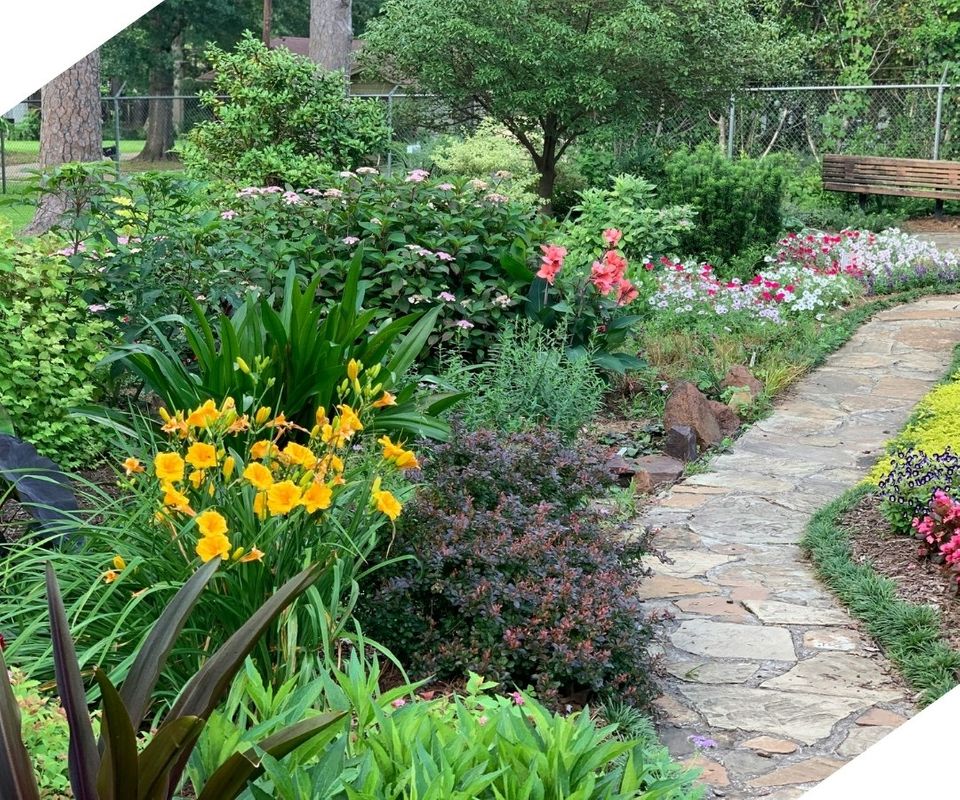 Xpressive Lawn & Landscape flower bed and stone walkway